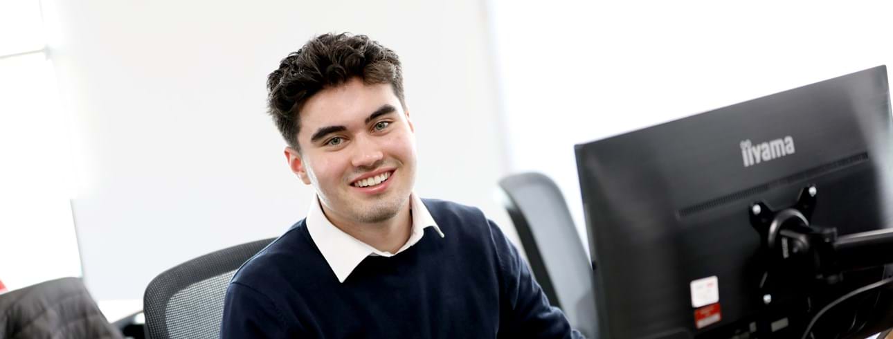 Livin apprentice Reece O'dwyer sitting at his desk
